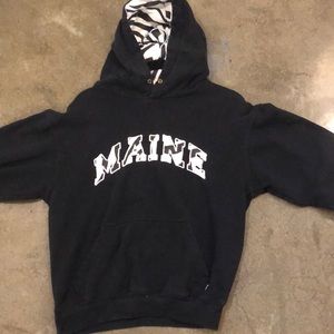 A black kids hoodie that says “maine” on it